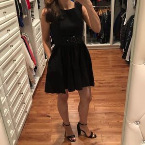 Black pocket cocktail dress
